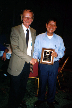 Ru Nguyen receives the Annual Award for Research from Howard Frank